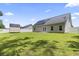 Large backyard with green grass, wood storage shed and solar panels at 1448 Tiger Grand Dr., Conway, SC 29526