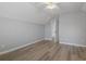 Bright bedroom with hardwood flooring, a ceiling fan, and ensuite at 1448 Tiger Grand Dr., Conway, SC 29526