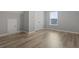 Cozy bedroom featuring hardwood flooring and a bright window at 1448 Tiger Grand Dr., Conway, SC 29526