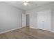 Spacious bedroom with hardwood flooring, a ceiling fan and a double closet at 1448 Tiger Grand Dr., Conway, SC 29526