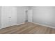 Bedroom features wood-look flooring, closet and entry doors, and neutral walls at 1448 Tiger Grand Dr., Conway, SC 29526