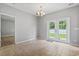 Open dining area featuring tiled floors and French doors to backyard at 1448 Tiger Grand Dr., Conway, SC 29526