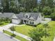 Exterior elevation showcasing lawn, landscape, driveway, and garage at 1448 Tiger Grand Dr., Conway, SC 29526