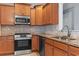 Kitchen with stainless steel appliances and granite countertops at 1448 Tiger Grand Dr., Conway, SC 29526