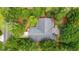 Aerial view of a lush home surrounded by trees, showcasing its secluded and peaceful setting at 149 Old Cedar Loop, Pawleys Island, SC 29585