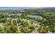 An aerial view of a community, featuring well-maintained homes, streets, and lush green trees near the ocean at 149 Old Cedar Loop, Pawleys Island, SC 29585