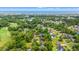 Aerial view of a neighborhood near the ocean, nestled among green trees, with a golf course visible at 149 Old Cedar Loop, Pawleys Island, SC 29585