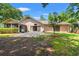 A spacious backyard with a patio and lush green grass at 149 Old Cedar Loop, Pawleys Island, SC 29585