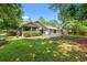 Large, tree-lined backyard with a patio at 149 Old Cedar Loop, Pawleys Island, SC 29585