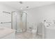 Bathroom with a corner shower, tiled floor, and white fixtures at 149 Old Cedar Loop, Pawleys Island, SC 29585
