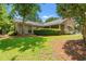 Well-maintained single-story home with manicured lawn and mature landscaping at 149 Old Cedar Loop, Pawleys Island, SC 29585