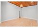 Large living room with wood-paneled ceiling and hardwood floors offers a flexible and adaptable space at 149 Old Cedar Loop, Pawleys Island, SC 29585