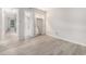 Cozy bedroom with view to bathroom, walk-in closet, modern gray flooring and neutral paint at 1500 Cenith Dr. # B-403, North Myrtle Beach, SC 29582