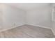 Empty bedroom showcasing light gray flooring, fresh paint and a window for natural light at 1500 Cenith Dr. # B-403, North Myrtle Beach, SC 29582