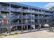 View of building offering multi-story access with stairs and parking at 1500 Cenith Dr. # B-403, North Myrtle Beach, SC 29582