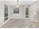 Bright dining area with light-grey wood-look flooring offers an inviting atmosphere at 1500 Cenith Dr. # B-403, North Myrtle Beach, SC 29582