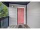 Condo entrance with painted door and wood deck offers private access to the unit at 1500 Cenith Dr. # B-403, North Myrtle Beach, SC 29582