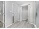 Bright condo entryway with closet and light-grey wood-look flooring, ready for your personal touch at 1500 Cenith Dr. # B-403, North Myrtle Beach, SC 29582
