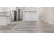 Living area features light-grey wood-look flooring with a stylish, open concept at 1500 Cenith Dr. # B-403, North Myrtle Beach, SC 29582