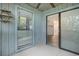 Cozy patio space with sliding glass doors and window, offering serene views and natural light at 1500 Cenith Dr. # B-403, North Myrtle Beach, SC 29582
