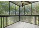 Enclosed porch featuring screens all around, providing an airy outdoor experience amidst lush greenery at 1500 Cenith Dr. # B-403, North Myrtle Beach, SC 29582