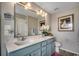 Double vanity bathroom with quartz countertops, modern fixtures, and ample cabinet space at 153 Goldenrod Circle # 7D, Little River, SC 29566