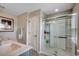 Bright bathroom with glass-enclosed shower, neutral tones, and modern fixtures at 153 Goldenrod Circle # 7D, Little River, SC 29566