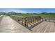 The wooden dock offers scenic views and access to the water, plus built-in seating at 153 Goldenrod Circle # 7D, Little River, SC 29566