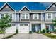 Charming townhome with gray siding, white trim, and a well-manicured lawn at 153 Goldenrod Circle # 7D, Little River, SC 29566