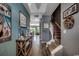 Hallway with beautiful wood-look floors leads to staircase and open concept kitchen and living areas at 153 Goldenrod Circle # 7D, Little River, SC 29566