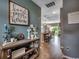 Stylish hallway offers views of the open kitchen featuring pendant lighting and barstool seating at 153 Goldenrod Circle # 7D, Little River, SC 29566