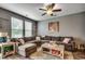 Spacious living room featuring comfortable seating, a ceiling fan, and lots of natural light at 153 Goldenrod Circle # 7D, Little River, SC 29566