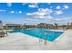 Community pool with inviting blue water and comfortable seating areas at 153 Goldenrod Circle # 7D, Little River, SC 29566