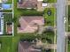 Birds eye view of a home with lush landscaping, a driveway, and pool in the backyard at 165 Northside Dr., Little River, SC 29566