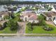 Aerial view of a beautiful home with lush landscaping in a serene neighborhood at 165 Northside Dr., Little River, SC 29566