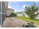 Spacious backyard with a concrete patio, lawn, and a white privacy fence at 165 Northside Dr., Little River, SC 29566