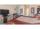 Serene bedroom featuring a decorative wrought iron bed frame and a full en suite bathroom at 165 Northside Dr., Little River, SC 29566
