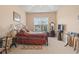 Bright bedroom with a tray ceiling, large window, carpeted floor and ample decor at 165 Northside Dr., Little River, SC 29566