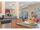 Open kitchen with a sink, island, and view to the breakfast nook at 165 Northside Dr., Little River, SC 29566