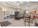 Spacious living room with high ceilings, neutral tones, and comfortable seating area at 165 Northside Dr., Little River, SC 29566