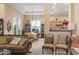 Open living area with neutral decor and seating, seamlessly connecting to the dining space at 165 Northside Dr., Little River, SC 29566