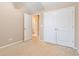 This bedroom features carpet and a doorway to the ensuite bathroom at 1654 Low Country Pl. # C, Myrtle Beach, SC 29577