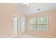 A neutral bedroom with an exit to an outdoor balcony and plenty of natural light at 1654 Low Country Pl. # C, Myrtle Beach, SC 29577