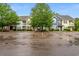 Townhomes with landscaping line a parking lot on a cloudy day at 1654 Low Country Pl. # C, Myrtle Beach, SC 29577