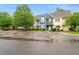 Townhomes with colorful facades, landscaping, and a parking lot at 1654 Low Country Pl. # C, Myrtle Beach, SC 29577