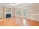 Spacious living room with wood floors, fireplace, and door to the backyard at 1654 Low Country Pl. # C, Myrtle Beach, SC 29577