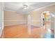 Bright living room with hardwood floors, neutral walls, and an archway to the kitchen at 1654 Low Country Pl. # C, Myrtle Beach, SC 29577