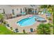 Aerial view of the backyard, featuring the pool, spa, patio, and manicured landscaping at 1715 Lake Egret Dr., North Myrtle Beach, SC 29582