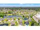 Picturesque aerial shot of a residential neighborhood with a scenic lake and lush green surroundings near the ocean at 1715 Lake Egret Dr., North Myrtle Beach, SC 29582