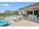 Inviting backyard featuring a pool, hot tub, lounge chairs, and covered patio at 1715 Lake Egret Dr., North Myrtle Beach, SC 29582